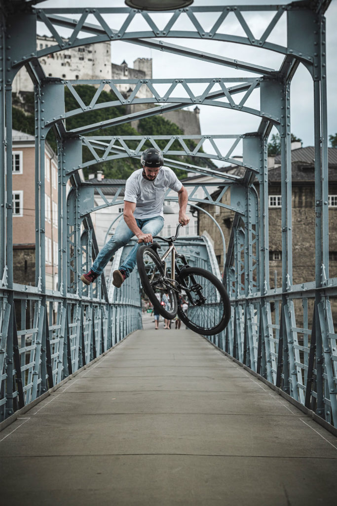 leafcycles team rider simon edfelder throwing a tail whip